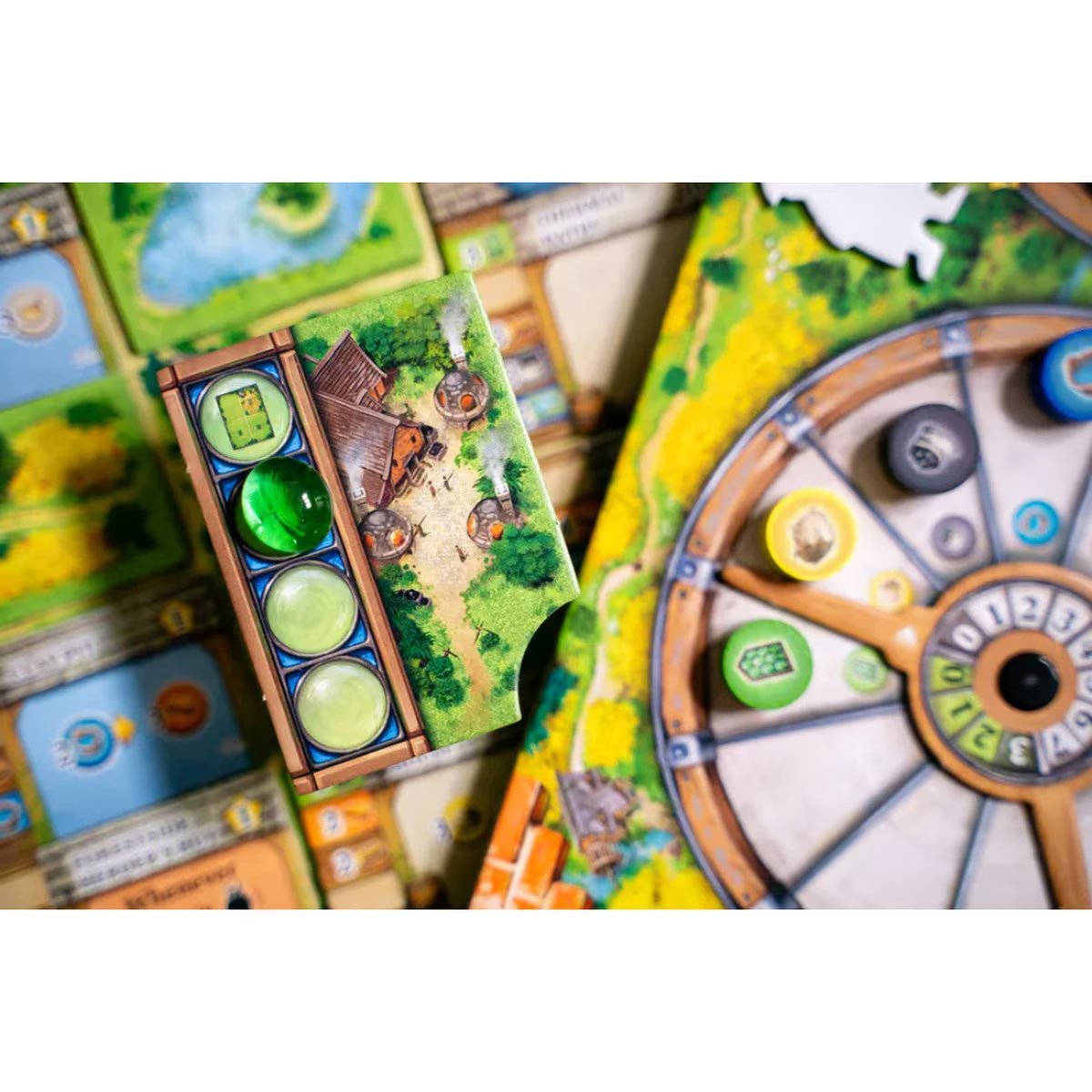 Black Forest board game close-up showing resource wheel glassmaking tile and euro strategy gameplay components