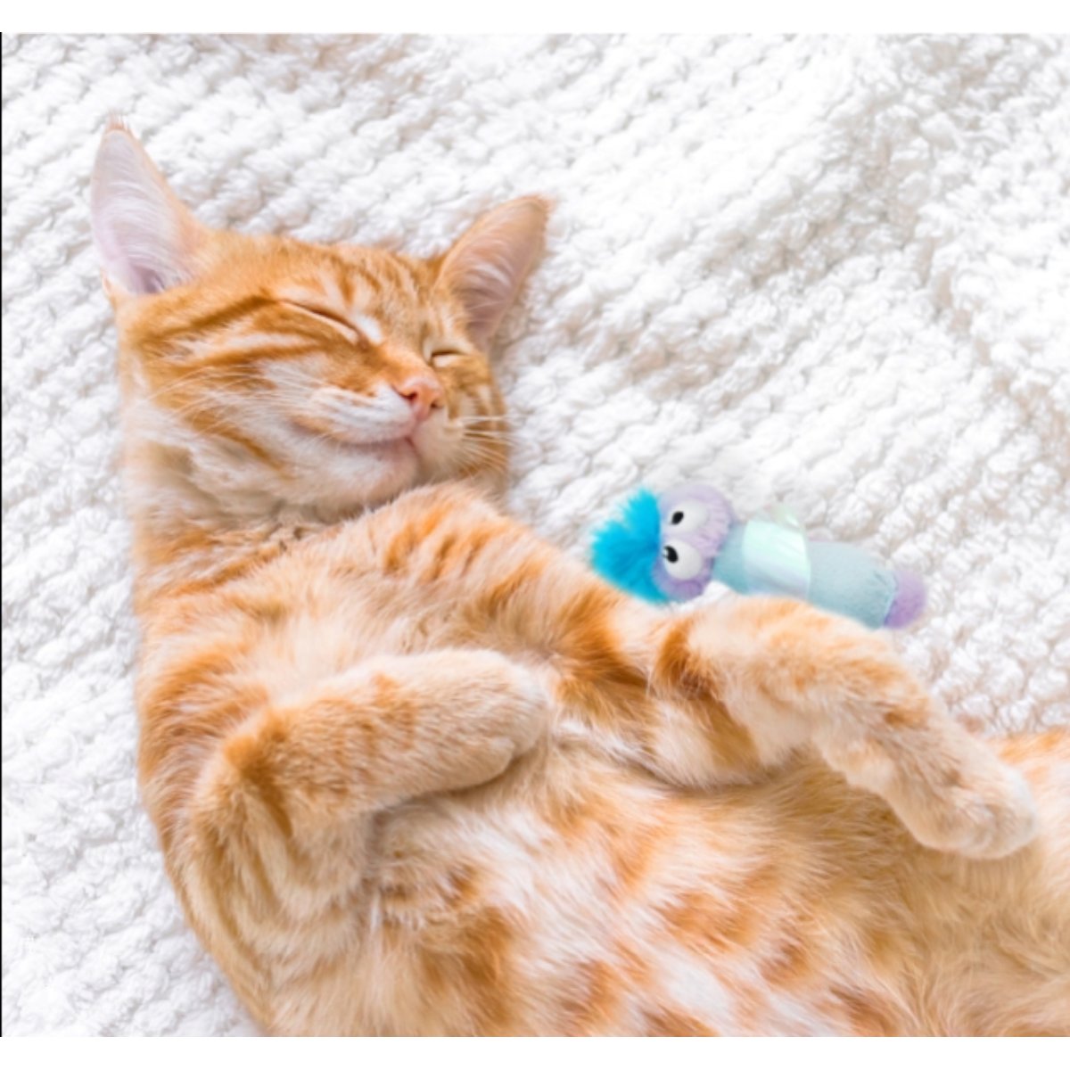 Cat playing with Catstages Swat n Treat Fairy Kicker toy