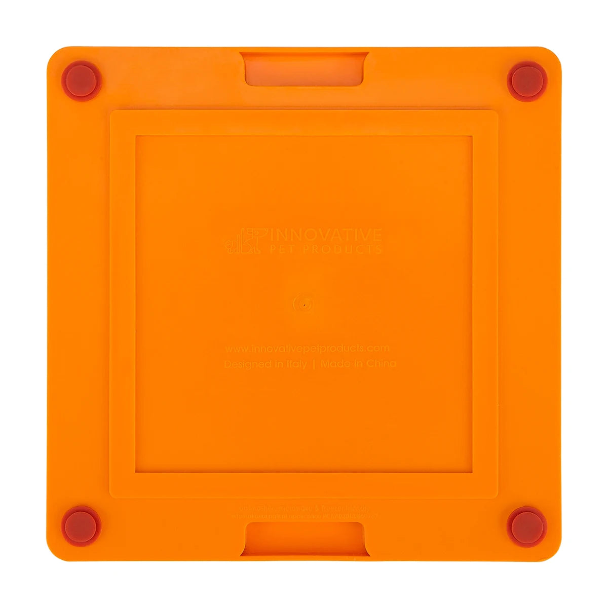 Underside of LickiMat TUFF Pro Soother orange with non slip feet for stable licking