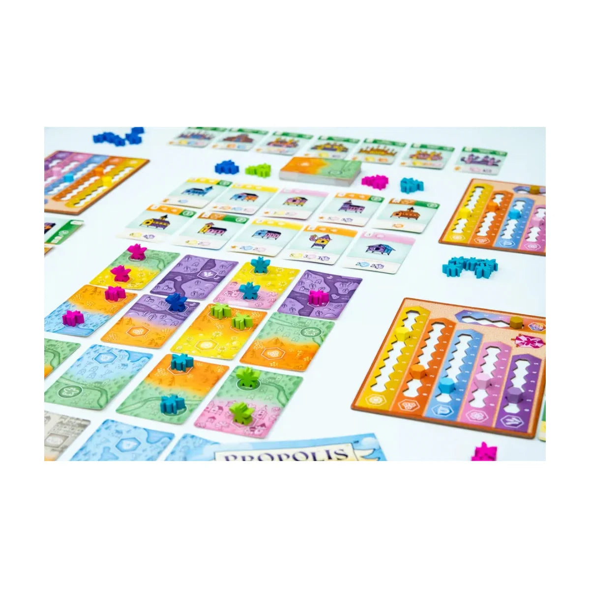 Propolis board game box and components layout with cards boards and wooden pieces