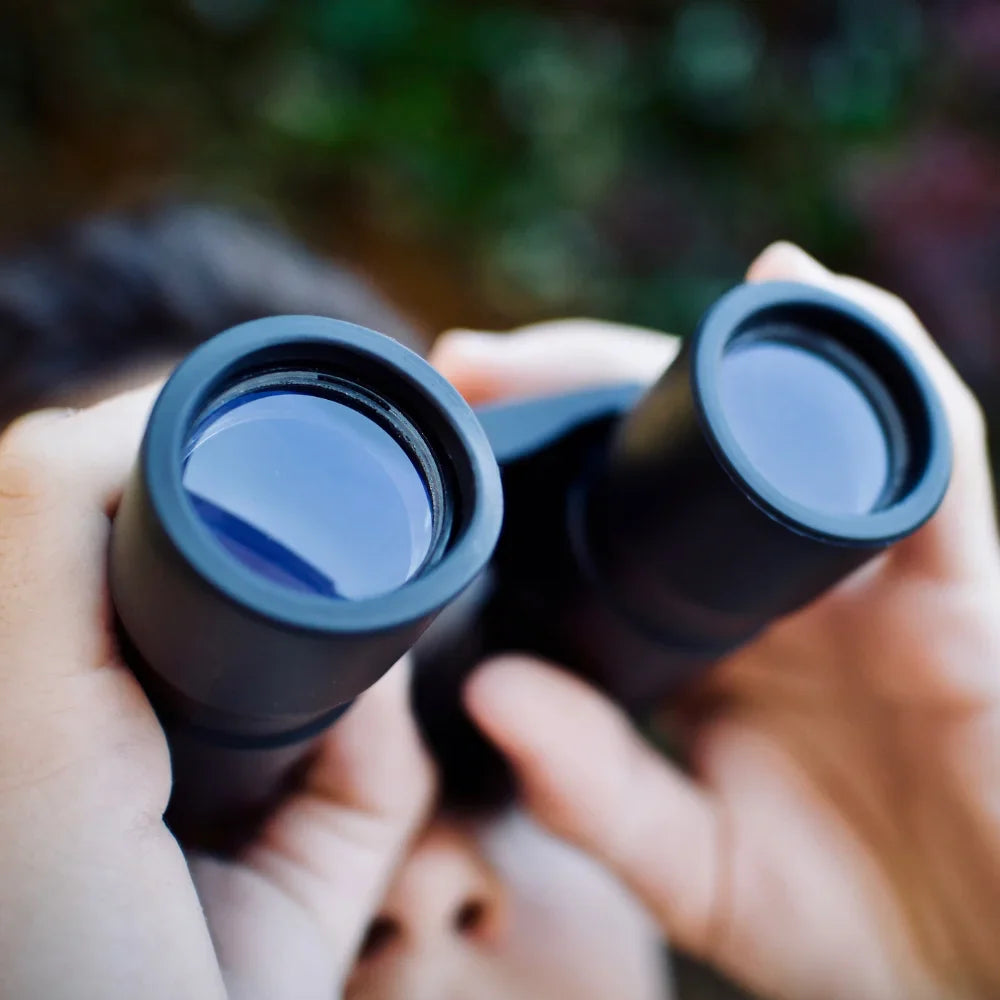 Child exploring with binoculars -Children’s Essentials Collection
