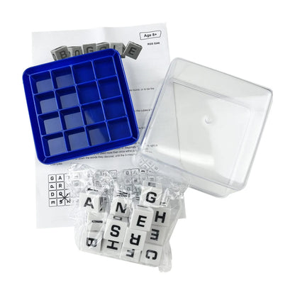Boggle game components laid out with base grid, clear lid, letter cubes and instructions