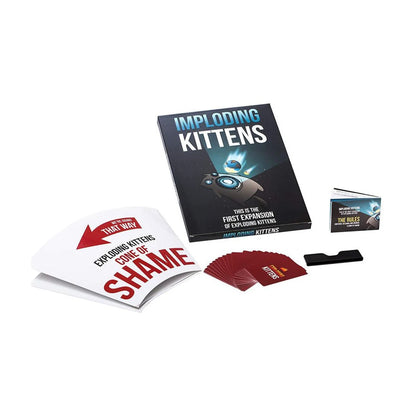 Exploding Kittens Imploding Kittens Expansion components with cards, Cone of Shame turn indicator, rulebook and card holder.