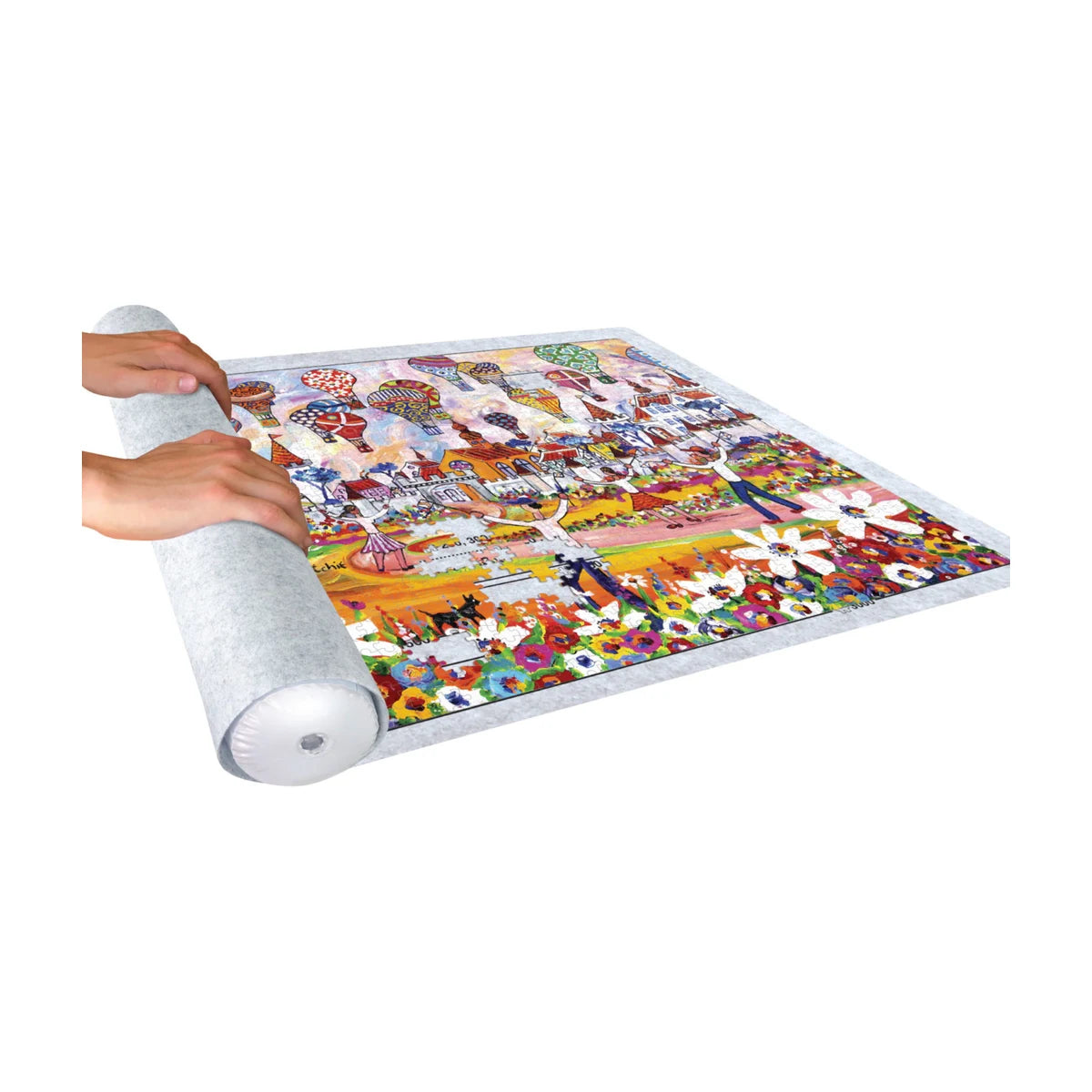 Hands rolling up a jigsaw puzzle on felt puzzle roll up mat for safe storage