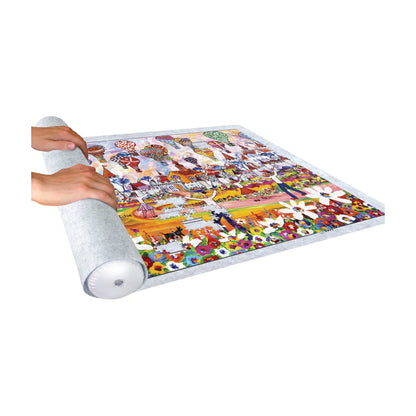 Hands rolling up a jigsaw puzzle on felt puzzle roll up mat for safe storage