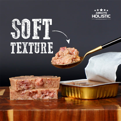 Soft pâté texture of Absolute Holistic Chicken Meaty Loaf Dog Food shown beside an open tray