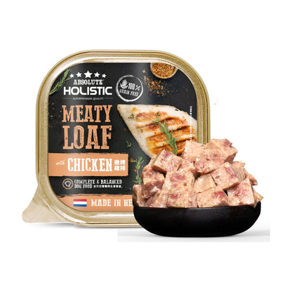 Absolute Holistic Meaty Loaf Chicken 100g tray beside a bowl of cubed loaf