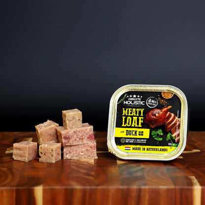 Absolute Holistic Meaty Loaf Duck tray and cubed loaf displayed on a wooden table