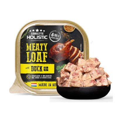 Absolute Holistic Meaty Loaf Duck 100g tray beside a bowl of cubed loaf