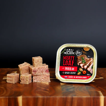 Absolute Holistic Meaty Loaf with Pork tray and cubed loaf displayed on a wooden table