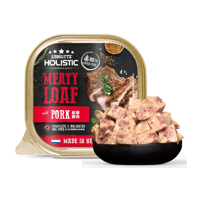 Absolute Holistic Meaty Loaf with Pork 100g tray beside a bowl of cubed loaf