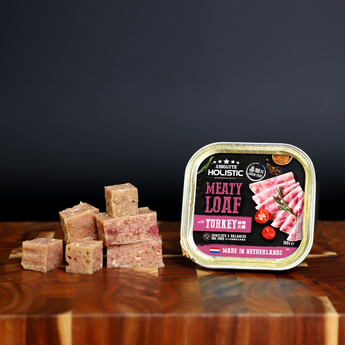 Absolute Holistic Meaty Loaf Turkey tray and cubed loaf displayed on a wooden table