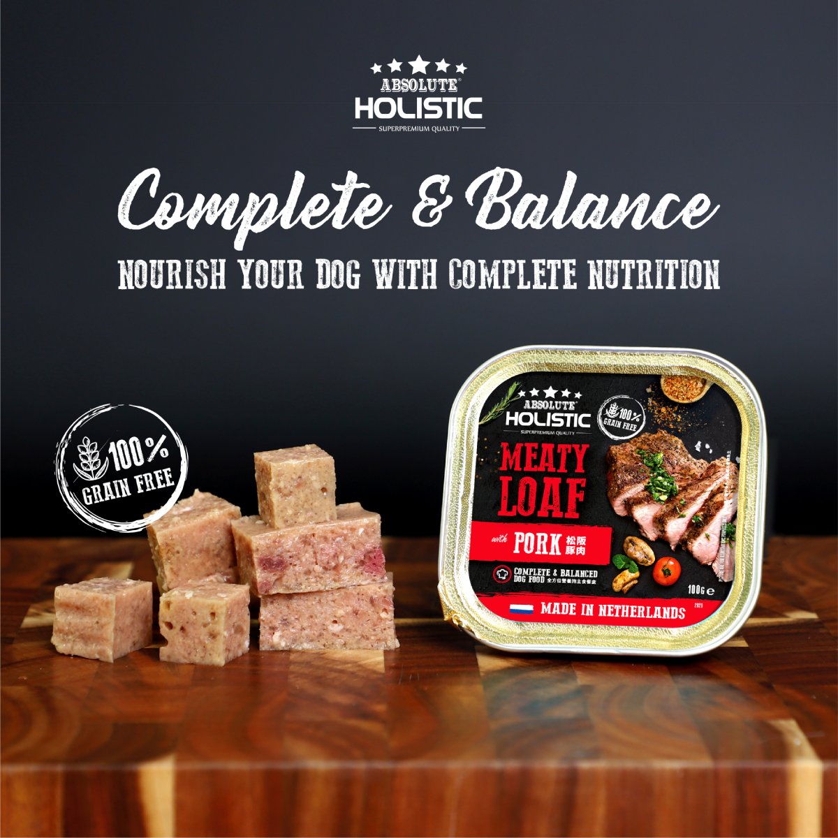 Absolute Holistic Pork Meaty Loaf 100g grain-free dog food tray with loaf cubes and complete nutrition message