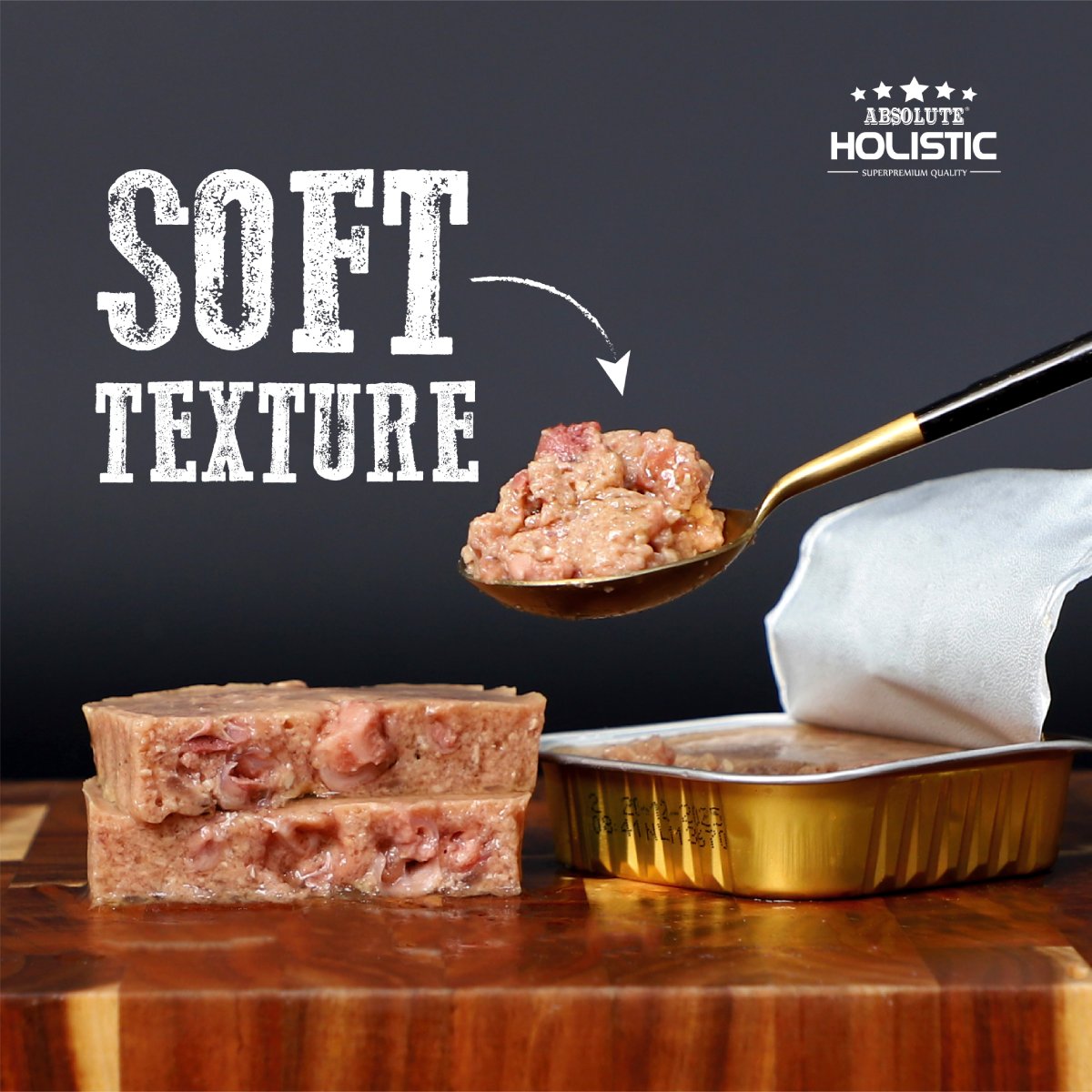 Soft pâté texture of Absolute Holistic Turkey Meaty Loaf Dog Food shown beside an open tray
