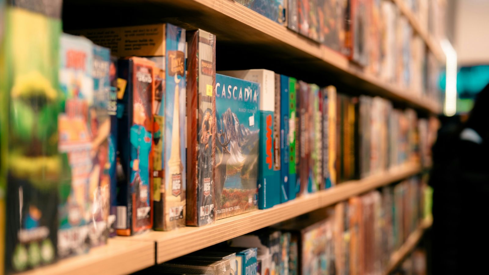 Selection of board games displayed on store shelves