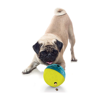 Pug playing with Nina Ottosson Treat Tumble small blue treat-dispensing dog puzzle toy