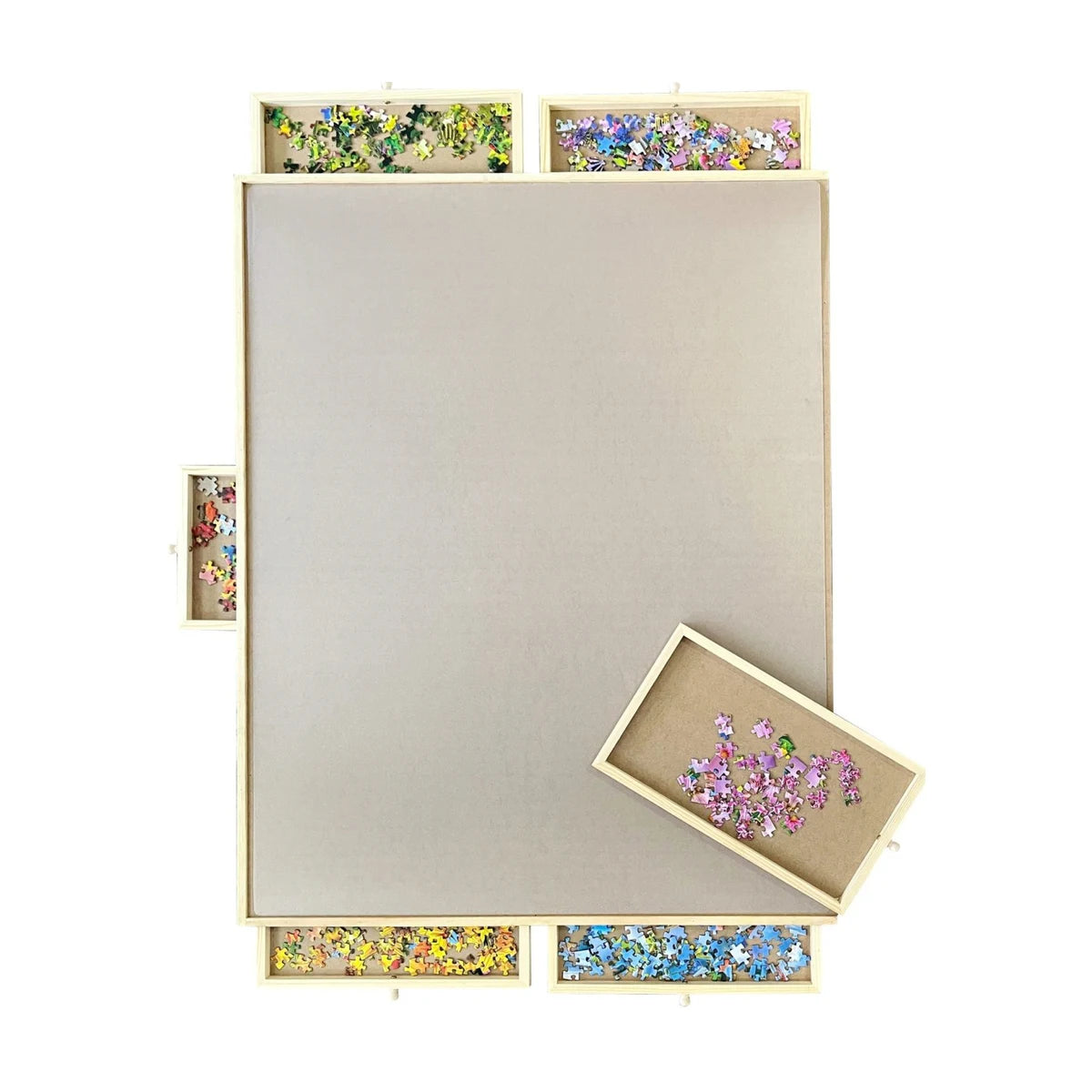 Low angle view of wooden rotating puzzle board with drawers showing sturdy build and easy access storage