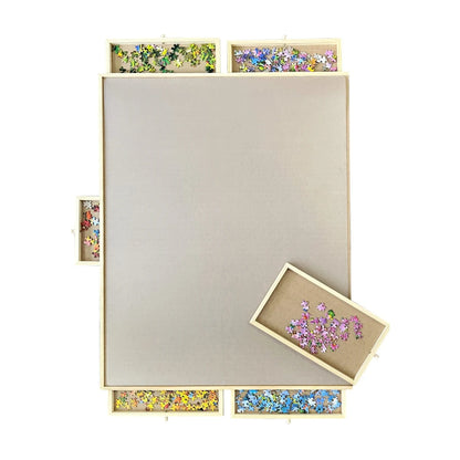 Low angle view of wooden rotating puzzle board with drawers showing sturdy build and easy access storage