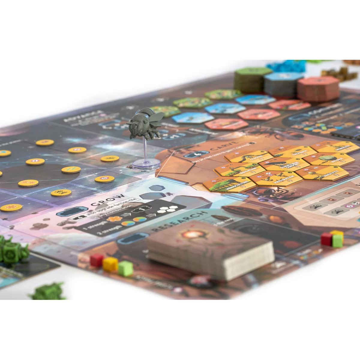 Apiary board game setup showing the QueenShip, hive tiles and game board