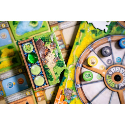 Black Forest board game close-up showing resource wheel glassmaking tile and euro strategy gameplay components