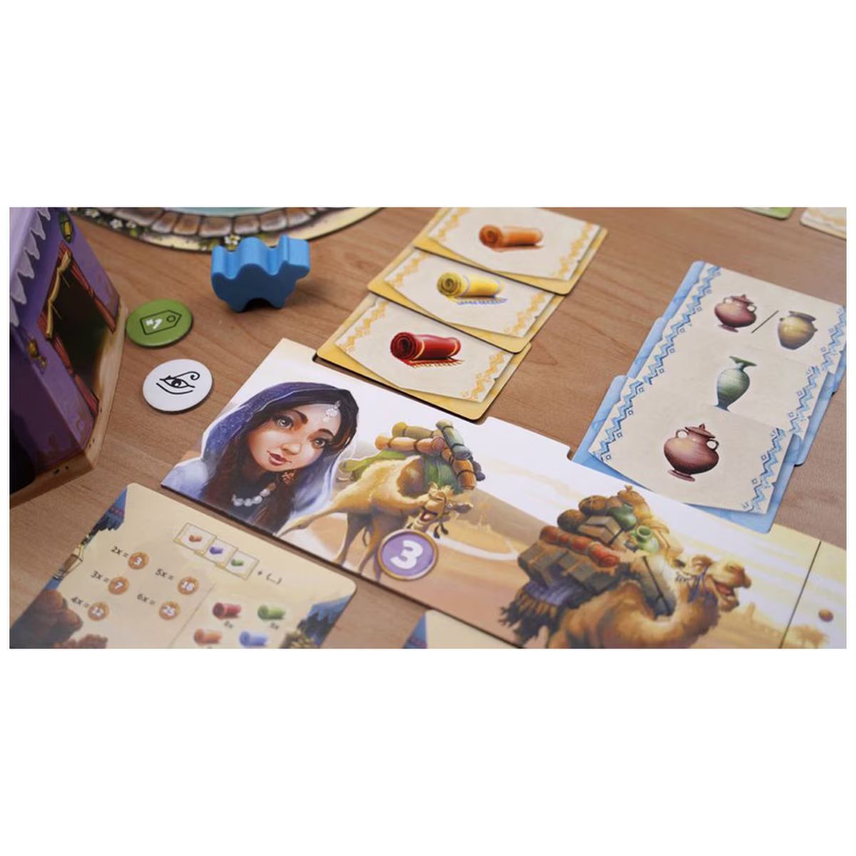 Camel Up Off Season board game close-up showing camel caravan player area and goods cards