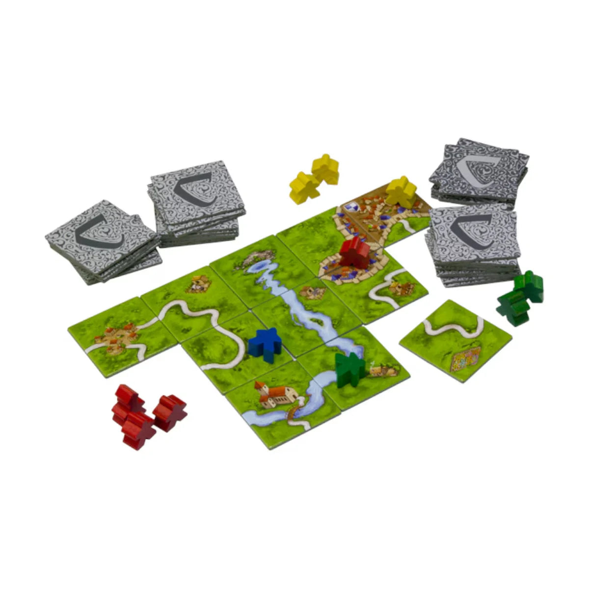 Carcassonne tile-laying board game setup with map tiles decks and meeples