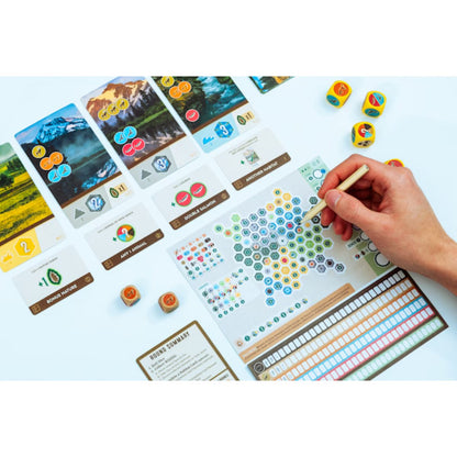 Cascadia Rolling Rivers gameplay setup with dice habitat cards scoring sheets and roll and write components
