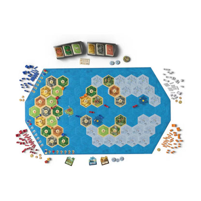 Catan Explorers and Pirates 6th Edition board setup with sea tiles, island hexes, ships, player pieces and mission components