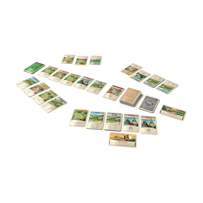 CATAN On the Road card game setup with roads settlements knights and resource cards