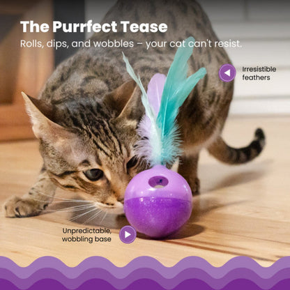 Cat playing with Catstages Wobble N' Treat cat toy with feathers and wobbling base