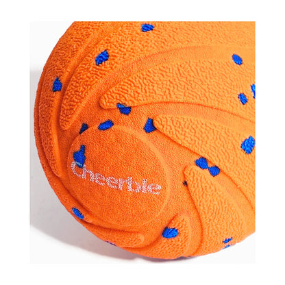 Close up of orange Cheerble Wicked Ball AIR textured outer shell detail