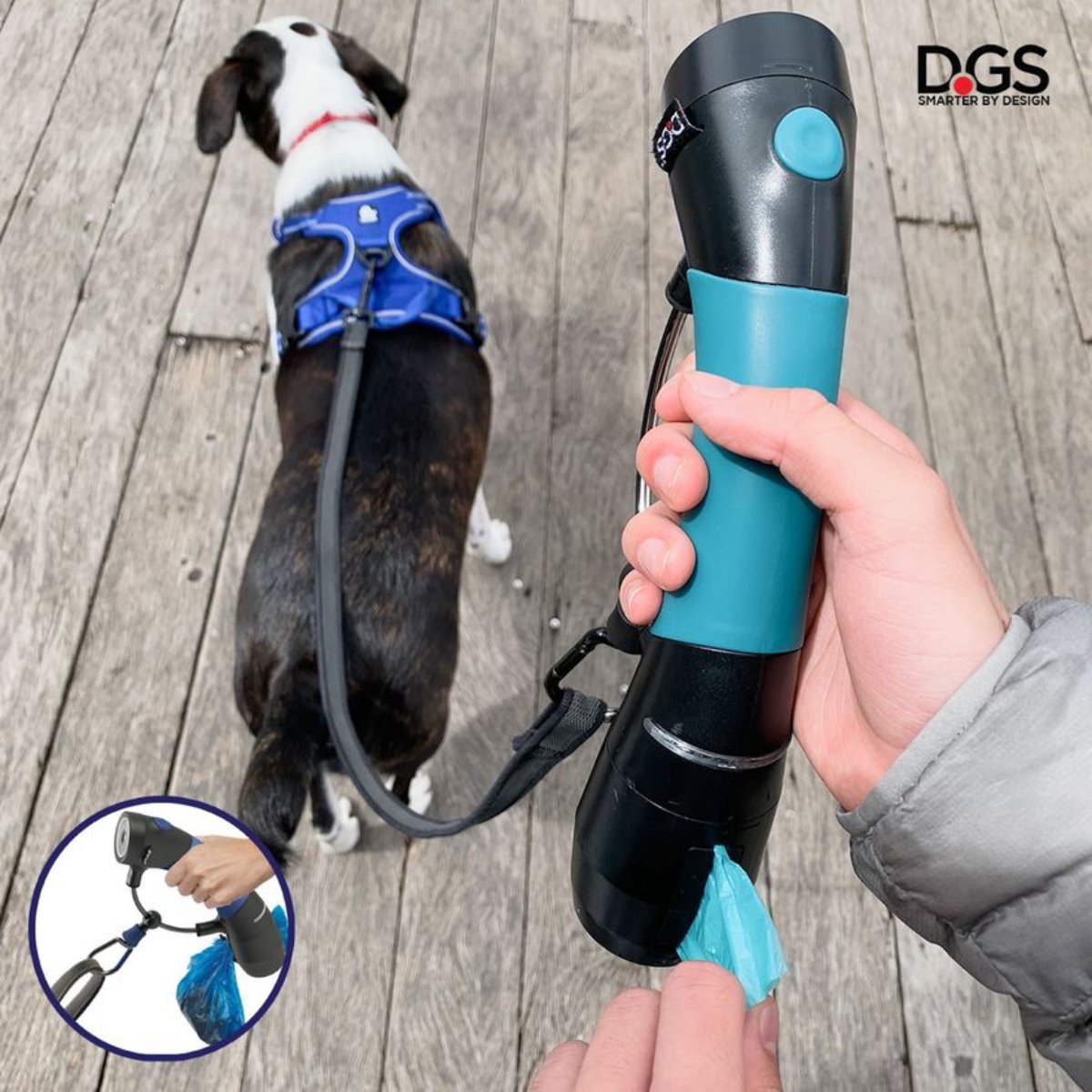 Person using the Electric Blue DGS Gismo dog leash handle with poop bag dispenser while walking a dog