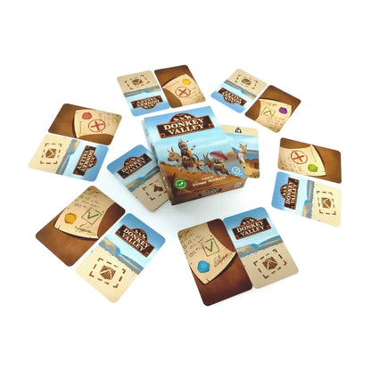 Donkey Valley Card Game box surrounded by load cards and approve or deny contract cards