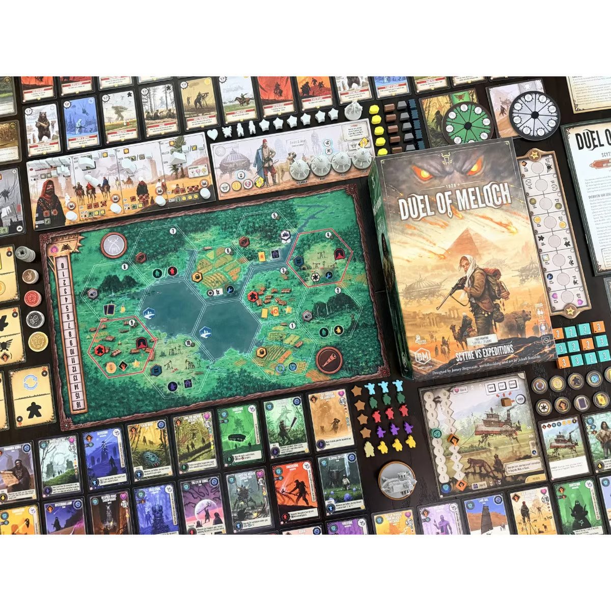 Duel of Meloch game setup showing double-sided map, cards, tokens, miniatures and player components
