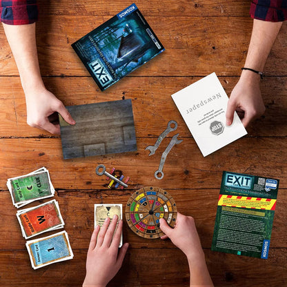 Players solving EXIT The Return to the Abandoned Cabin escape room board game on a table
