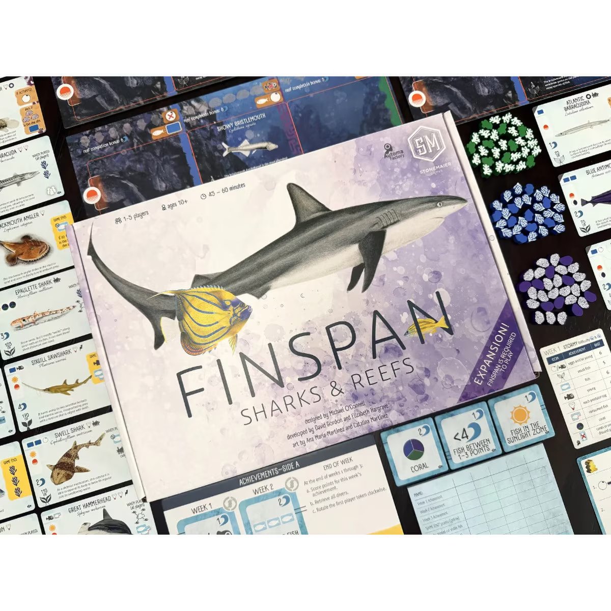 Finspan Sharks & Reefs Expansion box with game components, cards, coral tokens and reef overlays
