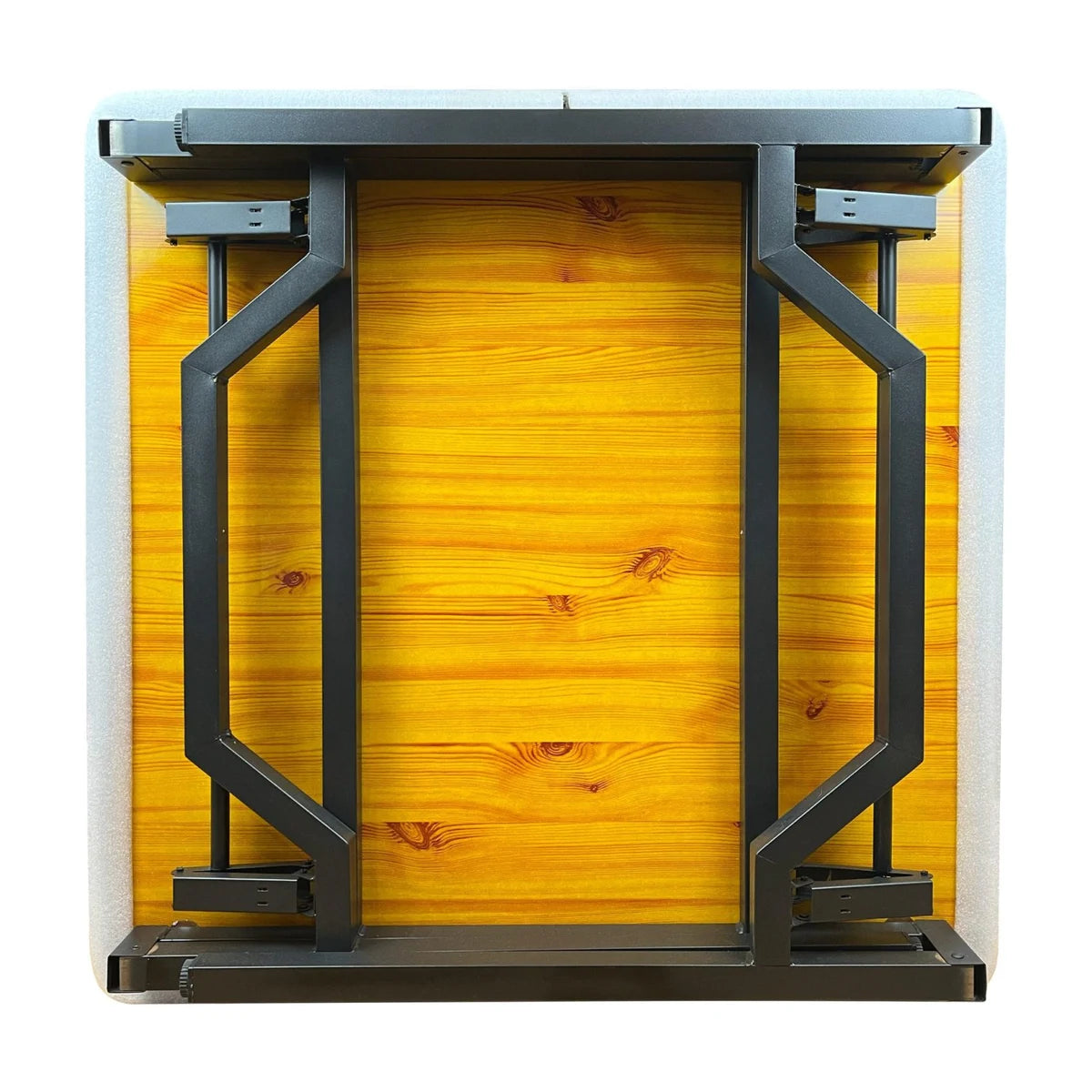 Underside of foldaway bridge table showing folded legs and compact storage frame