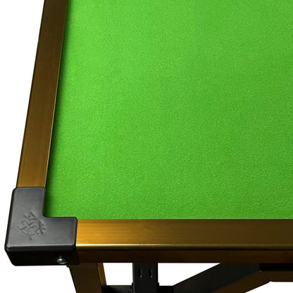 Close-up of green felt bridge table surface with frame and reinforced corner