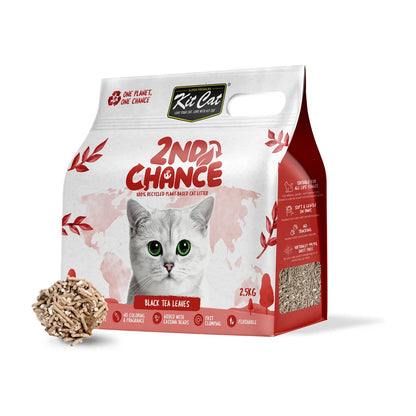 Kit Cat 2nd Chance Black Tea cat litter bag displayed with a clump of the plant-based litter