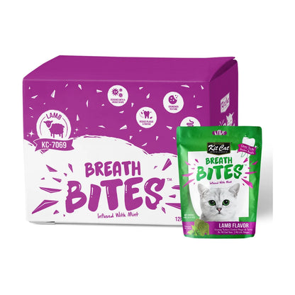 Kit Cat Breath Bites Lamb Cat Dental Treats 12 x 60g bulk box displayed with an individual green lamb-flavoured mint-infused dental treat pouch on a white background.