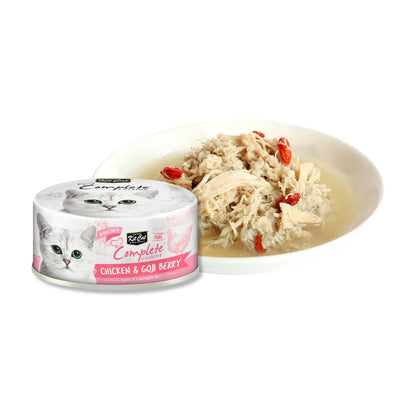 Kit Cat Complete Cuisine Chicken & Goji Berry can beside chicken flakes and goji berries in broth