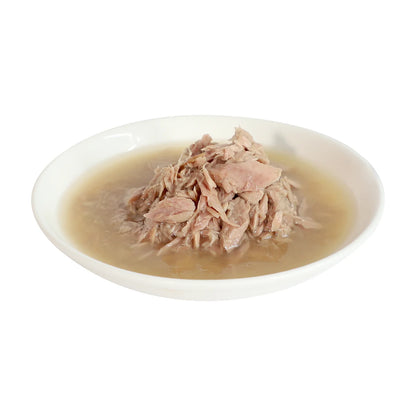 Kit Cat Complete Cuisine tuna and salmon wet cat food in broth on a plate