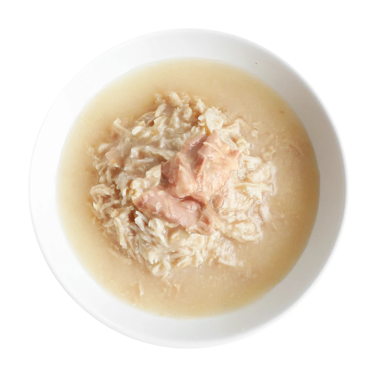Boneless chicken shreds and salmon wet cat food with goat milk in a white bowl