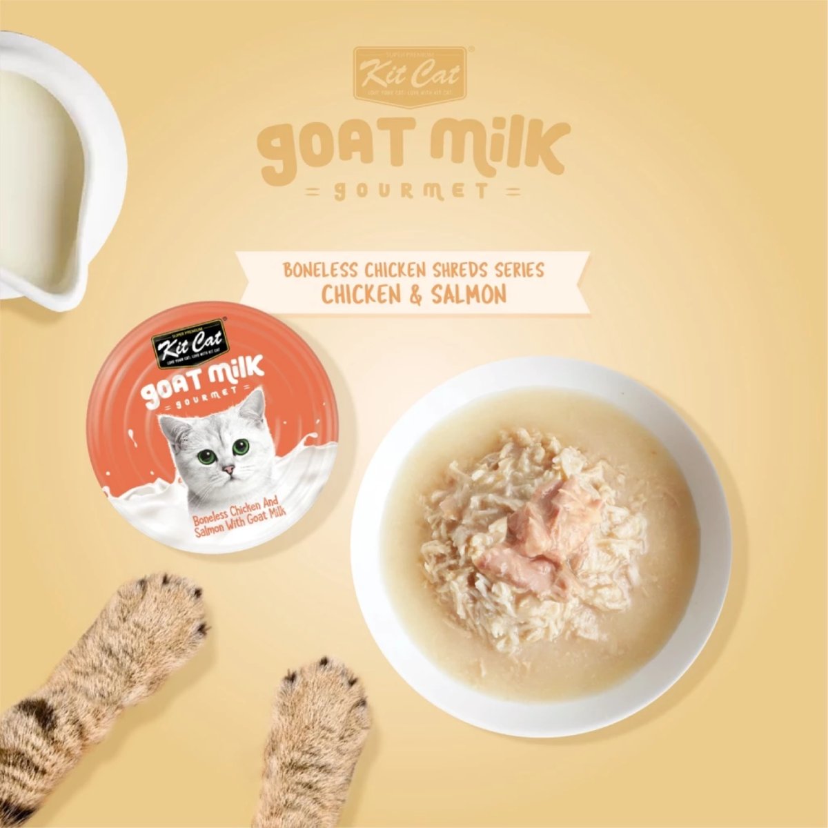 Kit Cat Goat Milk Gourmet chicken and salmon can beside wet cat food in a bowl
