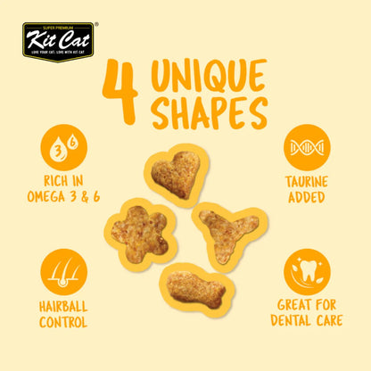 Four Kit Cat Kitty Crunch Chicken treat shapes with taurine Omega 3 and 6 hairball and dental care benefits