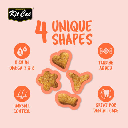 Four Kit Cat Kitty Crunch Salmon treat shapes with taurine Omega 3 and 6 hairball and dental-care benefits