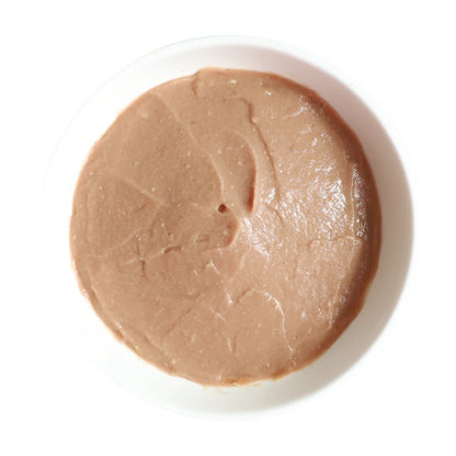 Kit Cat Purr Puree Plus+ Tuna lickable cat treat in a white bowl, displaying the smooth and creamy puree consistency.