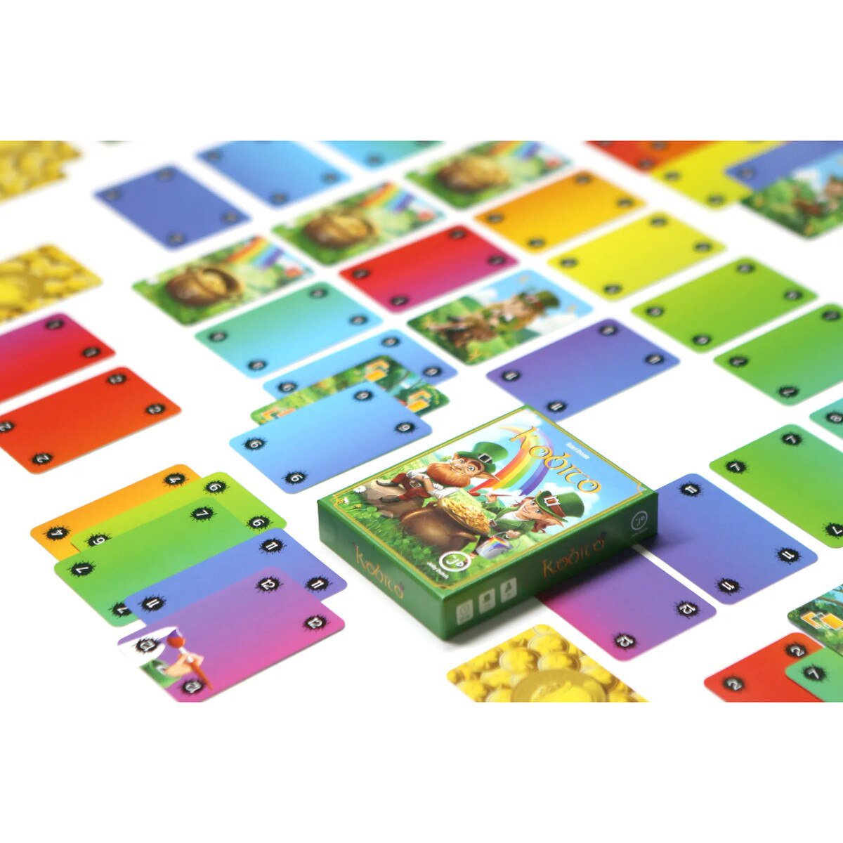 Kobito Card Game box surrounded by colourful rainbow cards and gold cards