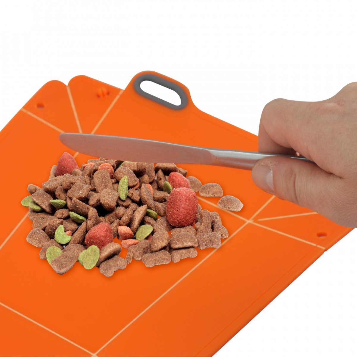 Pet food being prepared on the flat L'Chic Chop2Bowl chopping board