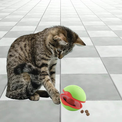 Cat playing with L’Chic Foobler Pop Shot treat dispenser for enrichment and reward play
